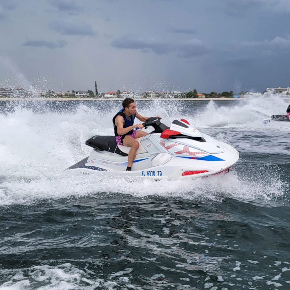 A man driving a jet ski