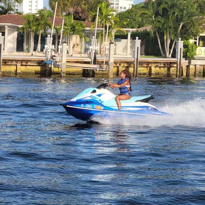 A woman driving a jet ski