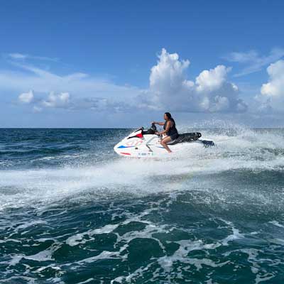 A woman driving a jet ski