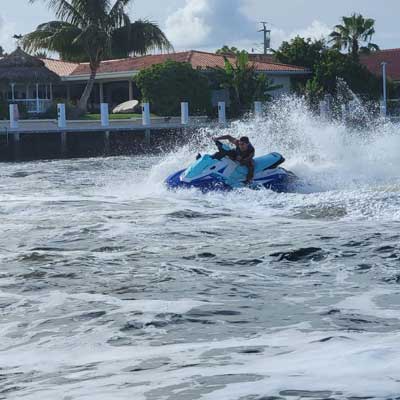 A man driving a jet ski